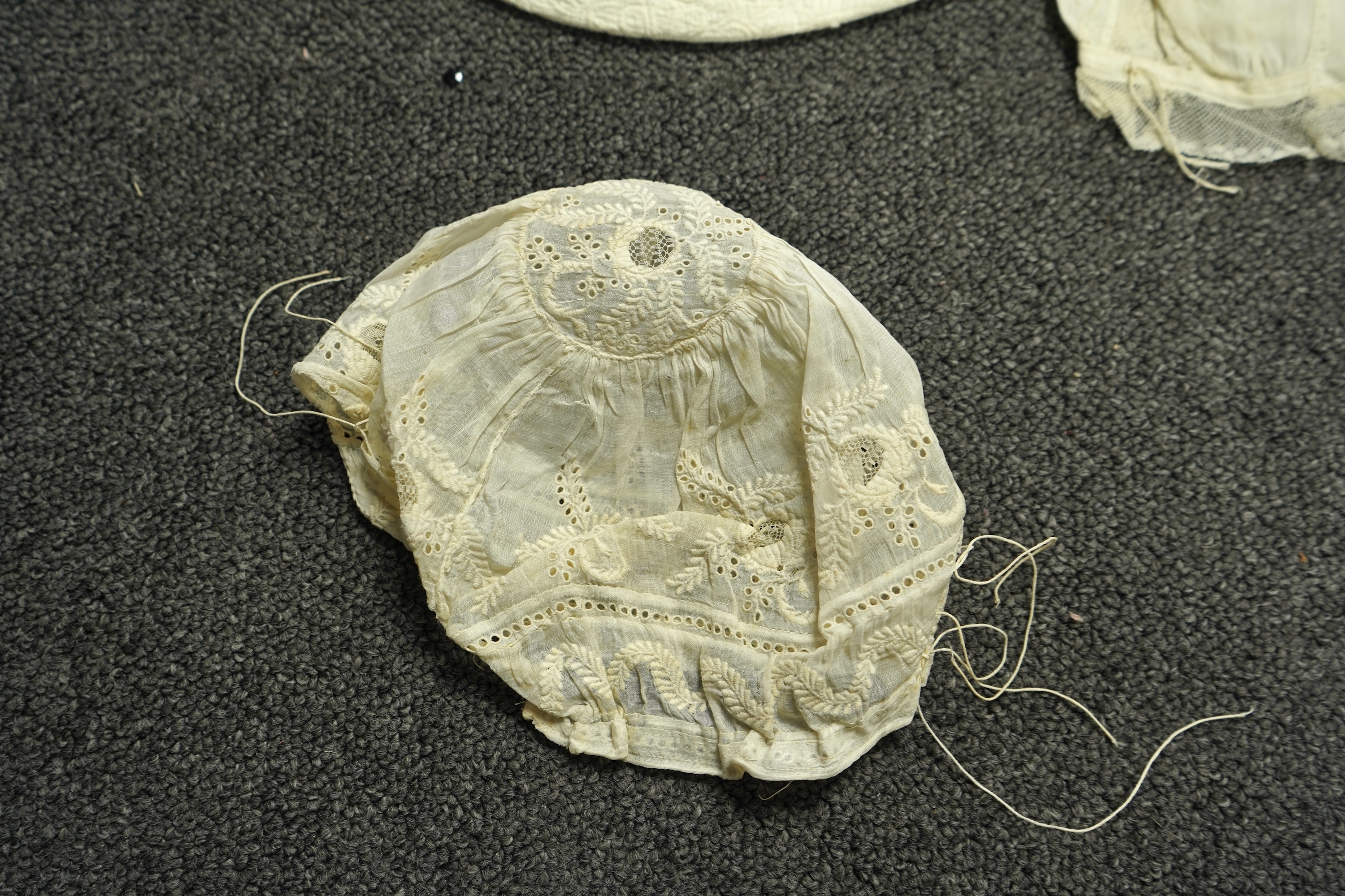 A collection of six baby’s bonnets from the mid 18th century to the late 19th century. An 18th century Hollie Point inserted baby bonnet, a quilted 18th century baby bonnet, two white work bonnets with needle lace crown